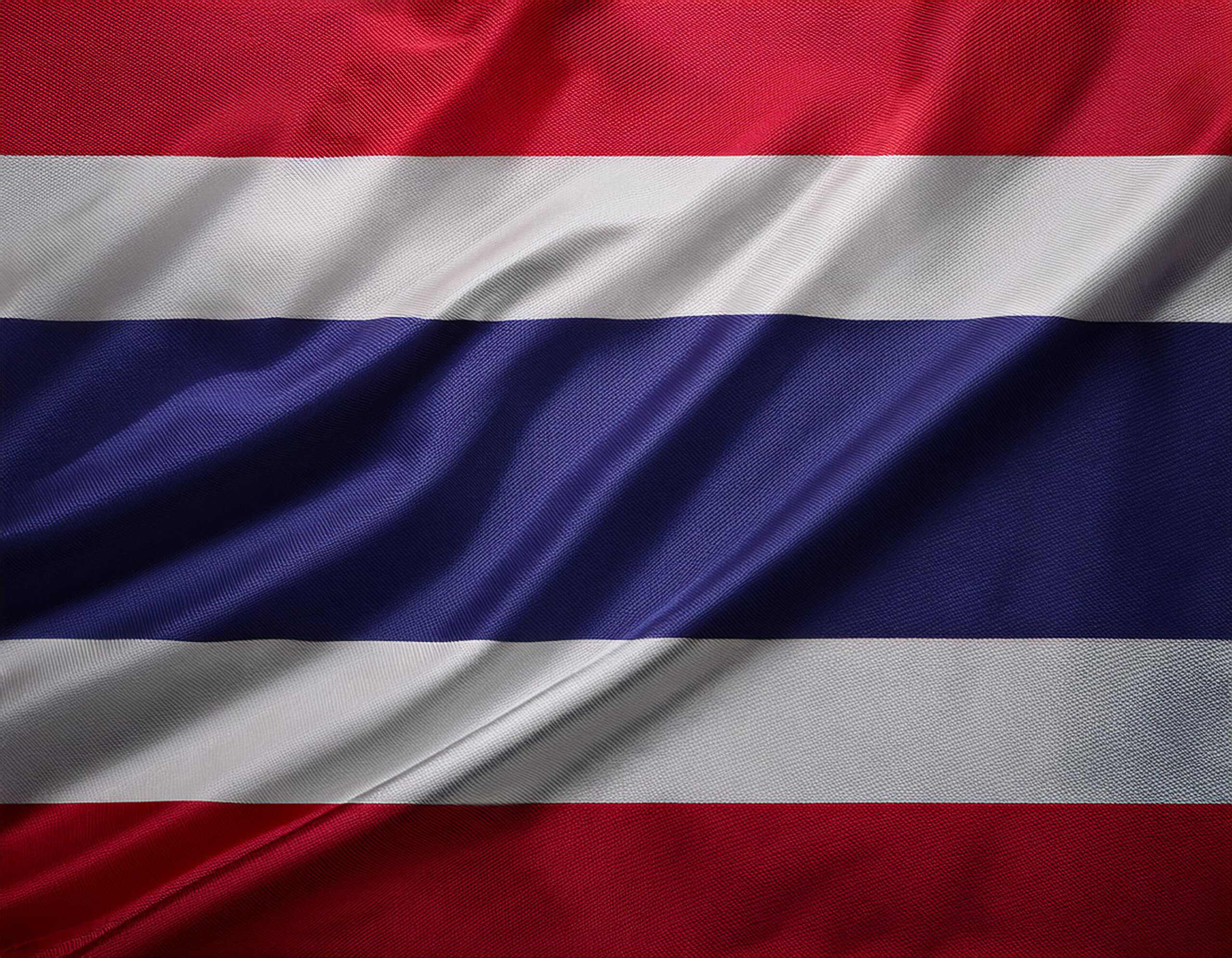 Waving Thailand flag with fabric texture representing British expats living in Thailand applying for UK mortgages